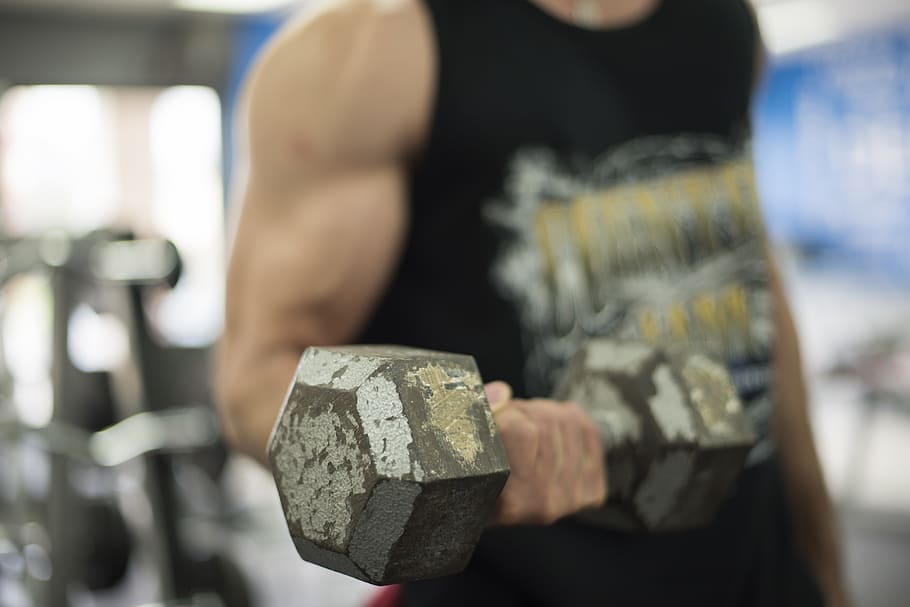 man in black and grey tank top lifting a grey hex-type dumbbell with his right hand, HD wallpaper