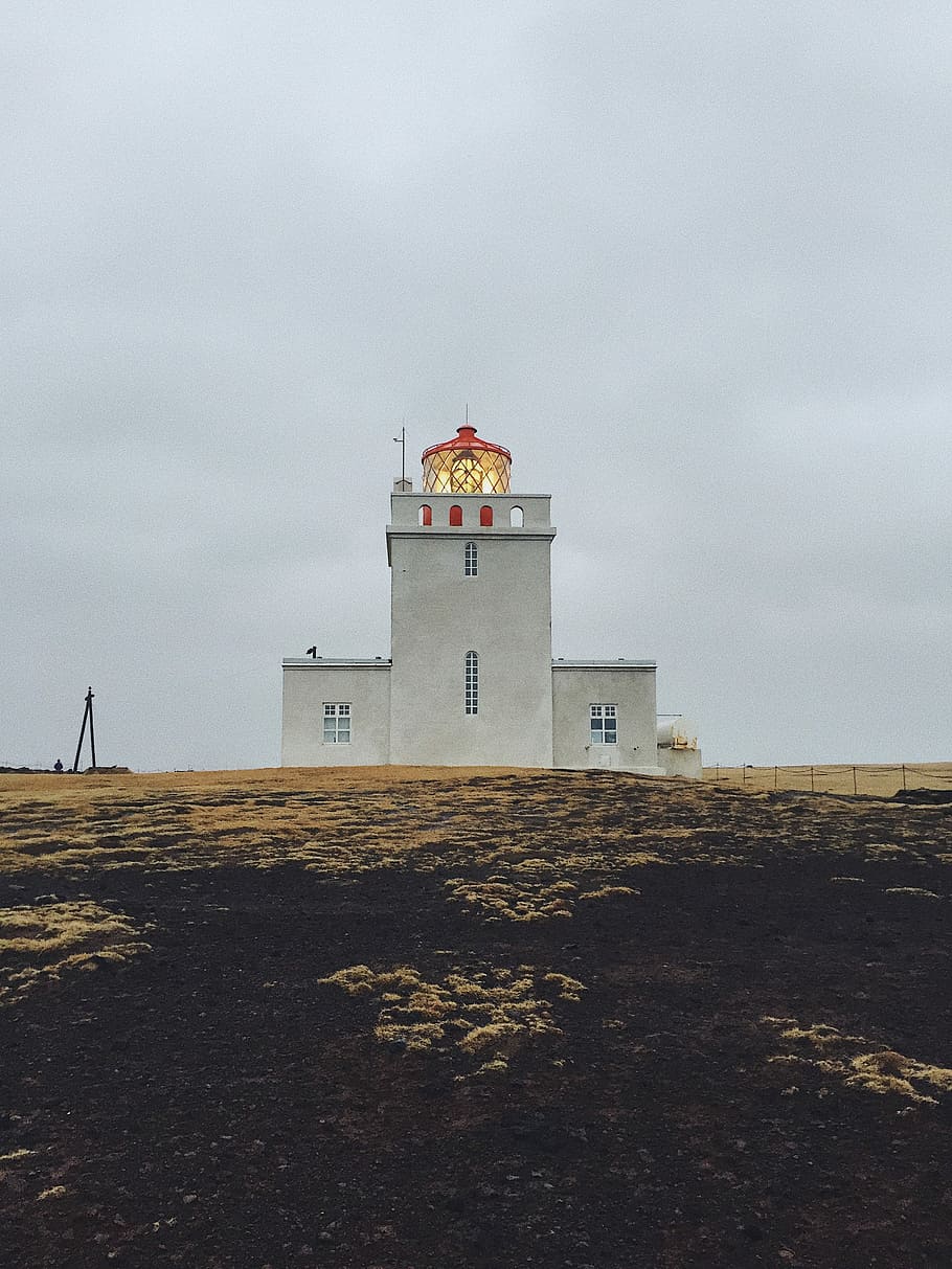 photography of white concrete building during daytime, white and red lighthouse on field HD wallpaper