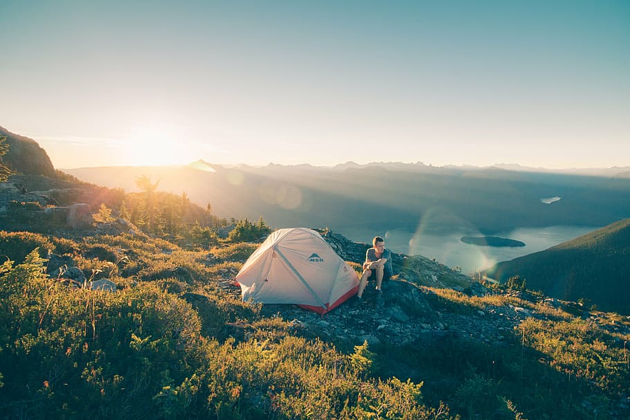 person sitting near tent on top of mountain, highland, cloud HD wallpaper
