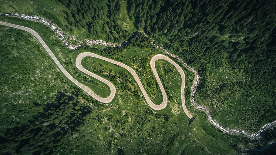 aerial view of asphalt road surrounded by trees, Transfagarasan by Drone