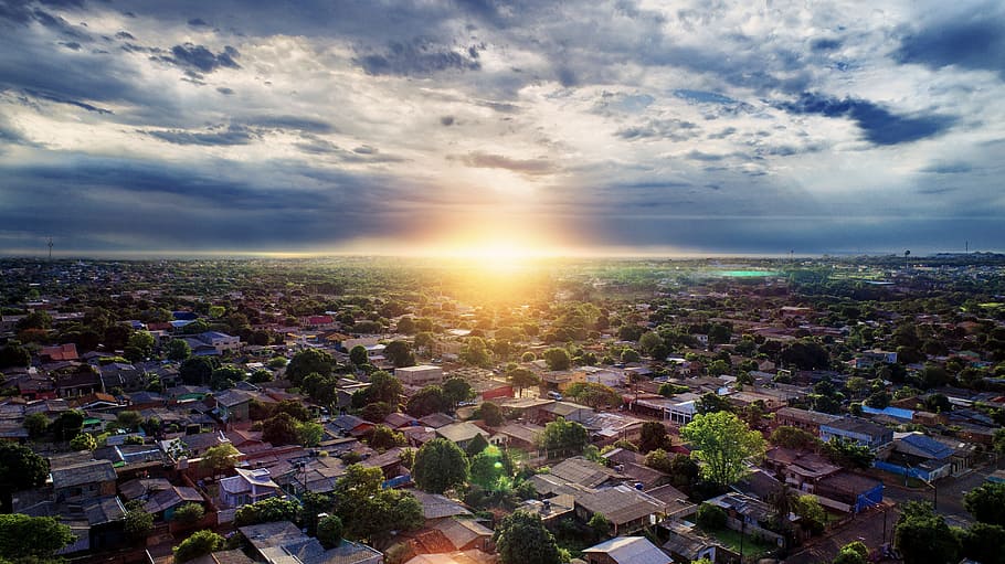 Aerial Photography of Buildings Under Blue and White Sky during Golden Hour HD wallpaper