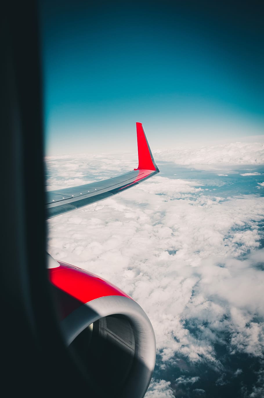 gray and red airplane, left gray and red airplane wing during daytime HD wallpaper