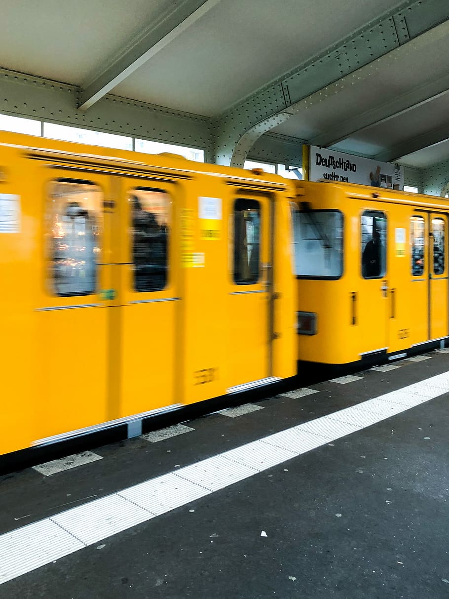yellow train on train station during daytime, moving orange train on train station HD wallpaper