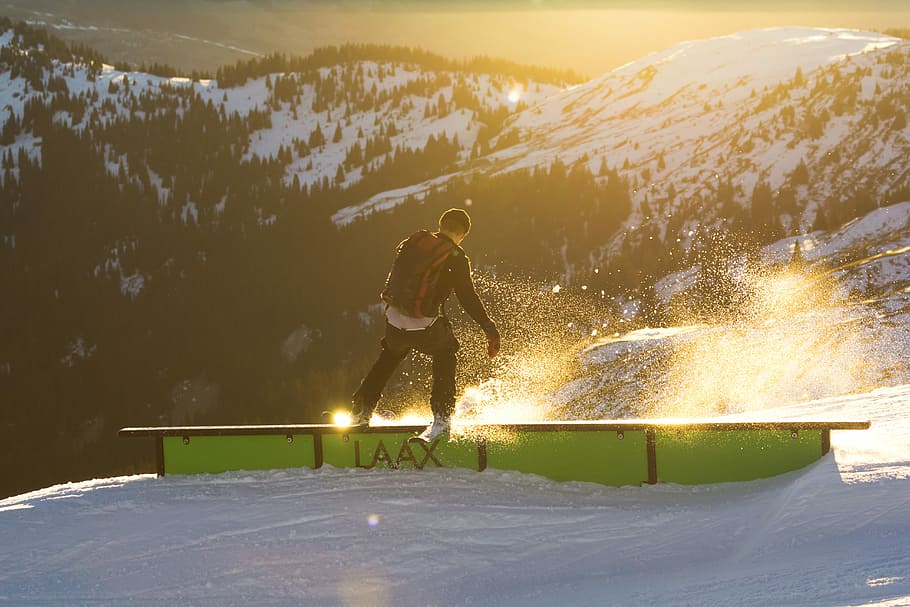 man riding ski on railings near mountain at daytime, man playing snow skis HD wallpaper
