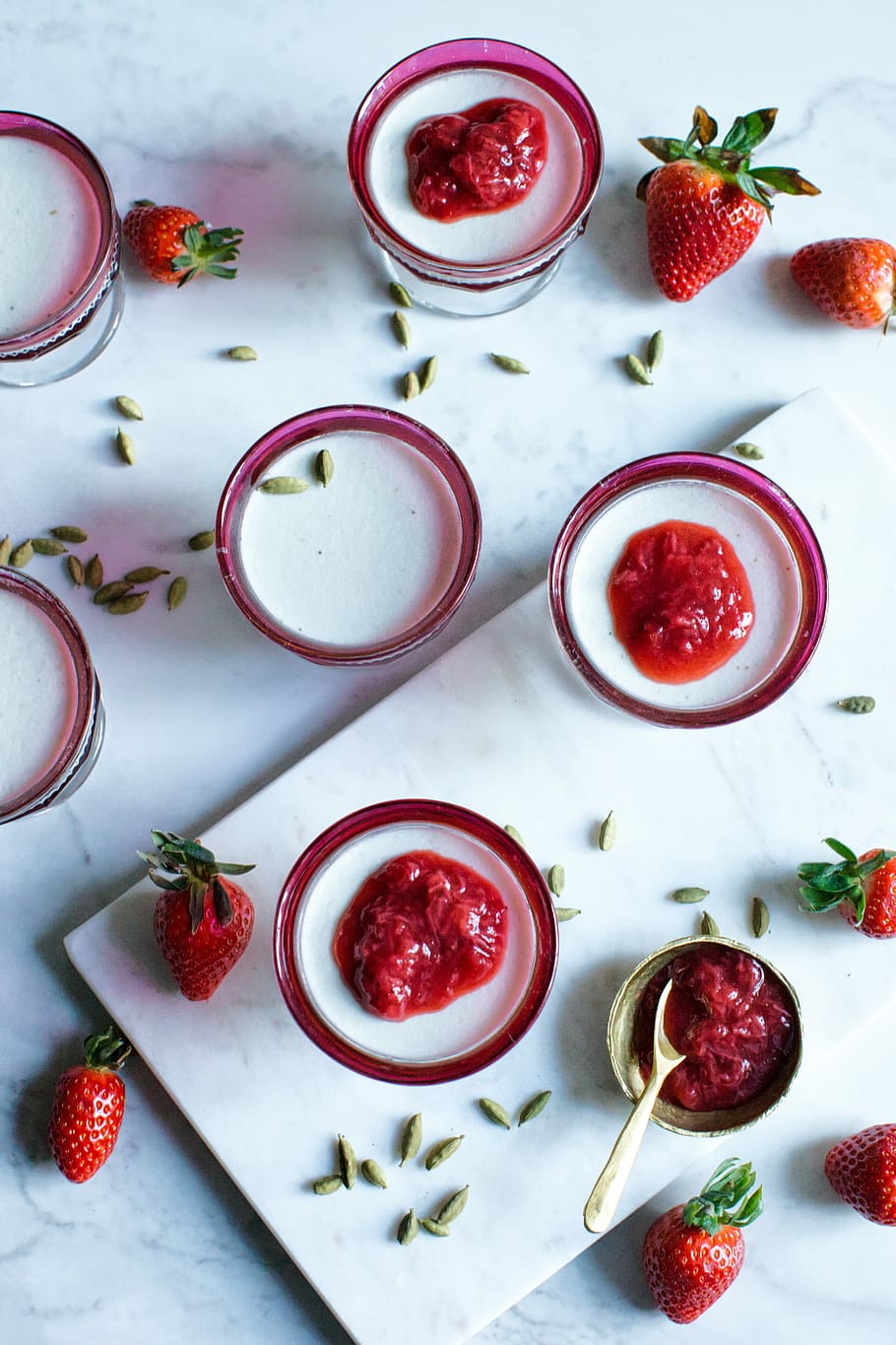 photo of clear glass filled with white liquid and strawberry toppings, strawberries lot HD wallpaper