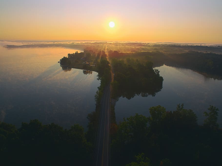 aerial photo of gray road between body of water, aerial photo of island HD wallpaper