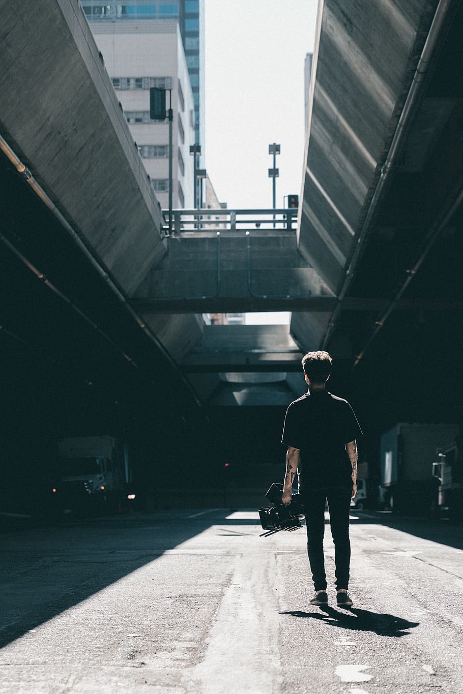 people, man, shadow, guy, day, bridge, fence, stoplight, back HD wallpaper