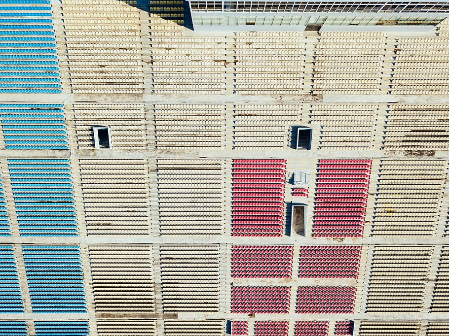 photo of brown and red boxes, white and red stadium chairs at daytime HD wallpaper