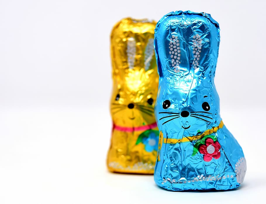 closeup photo of blue and yellow rabbit chocolate pack on white surface HD wallpaper