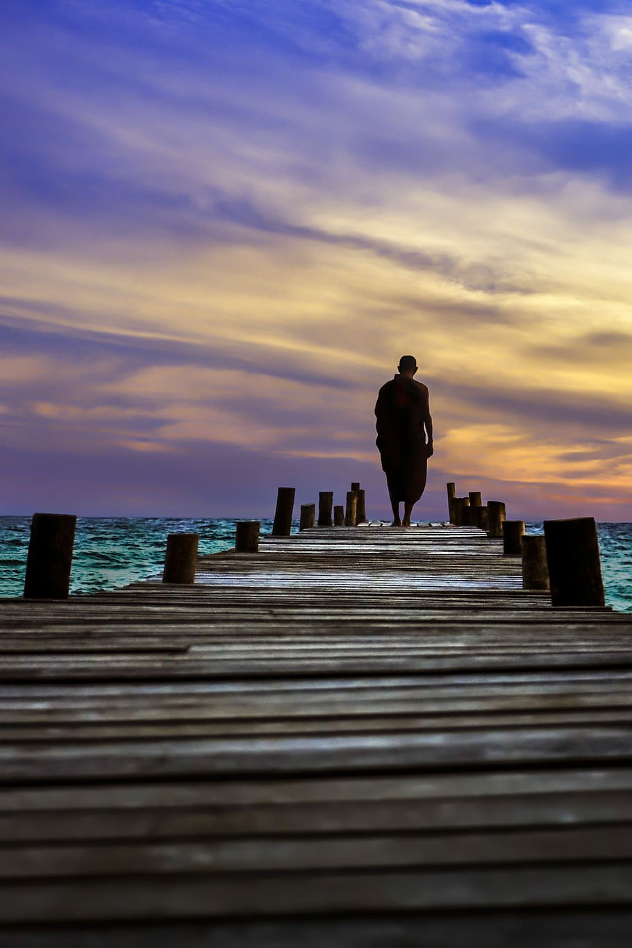 man walking on wooden dock at daytime, sunset, sky, outdoors HD wallpaper