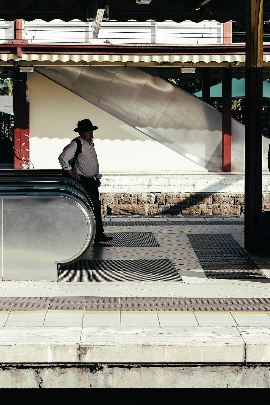 man beside escalator, man standing beside escalator, person, street, HD wallpaper