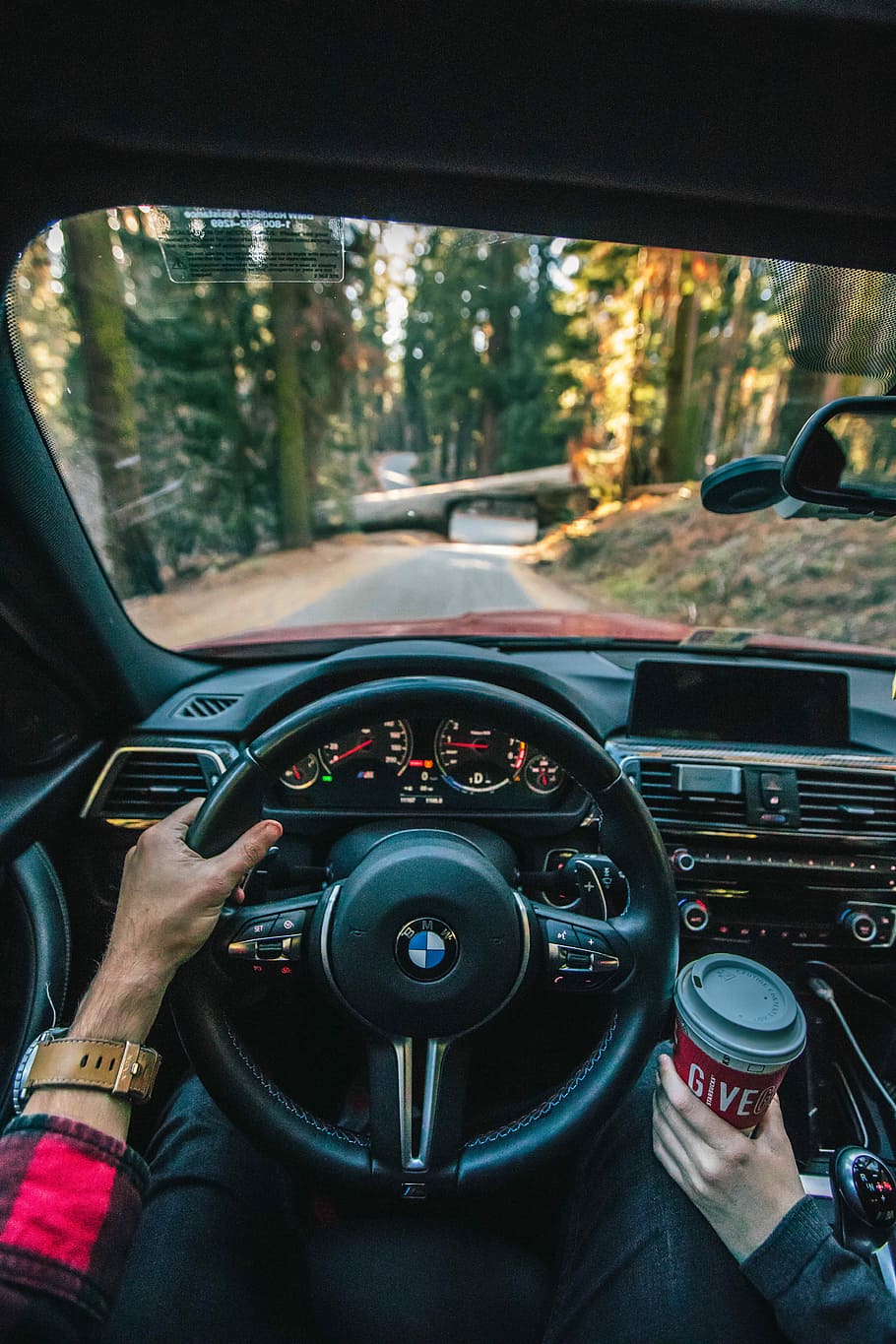 black BMW steering wheel, person driving BMW vehicle on road, HD wallpaper