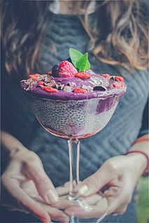 shaved ice with strawberry and blueberry toppings, woman holding bowl of ice creams with strawberries and blueberries HD wallpaper