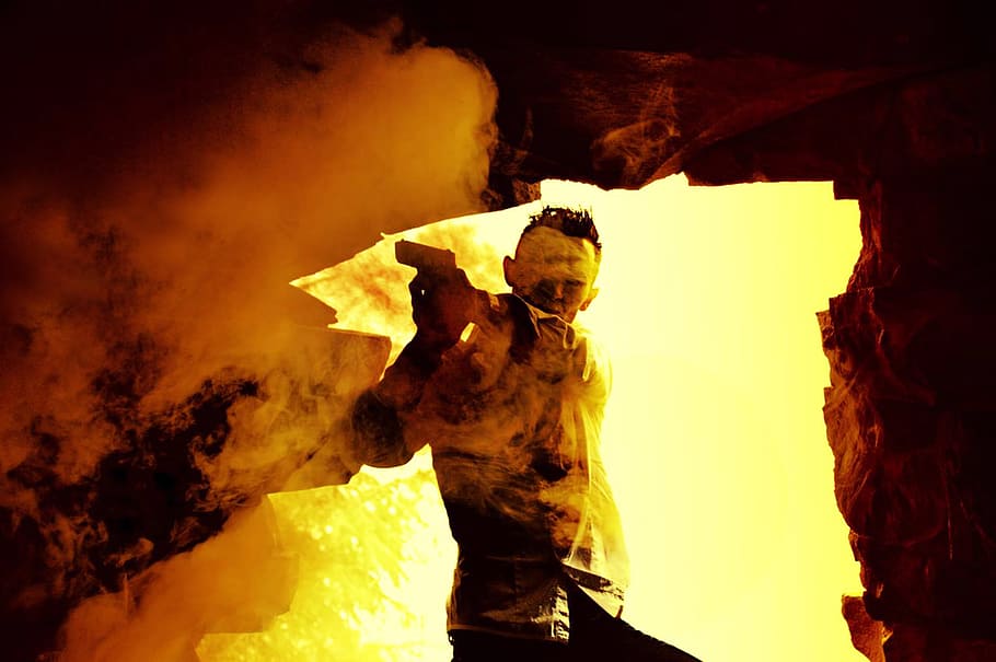male profile holding pistol wallpaper, man, weapon, fire, explosion HD wallpaper