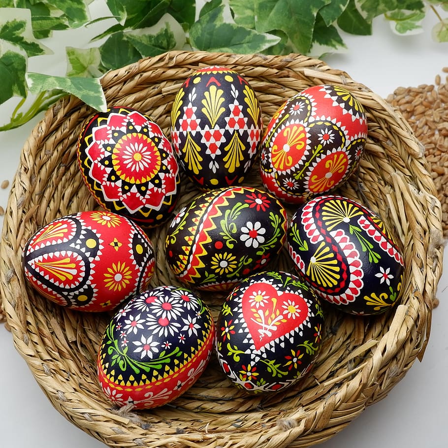 closeup photo of decorative eggs on nest, sorbian easter eggs