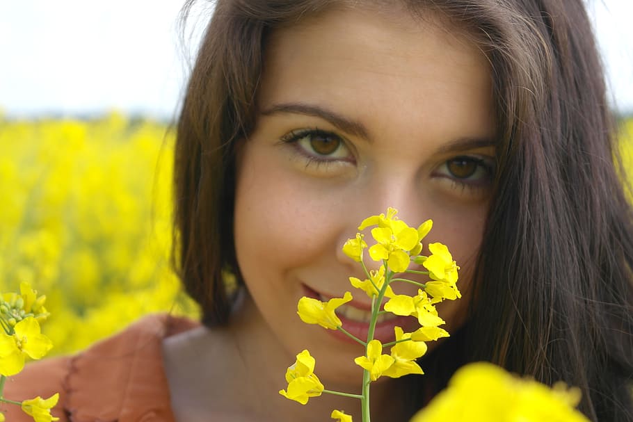 closeup photography of woman behind yellow flowers, Oilseed Rape, HD wallpaper