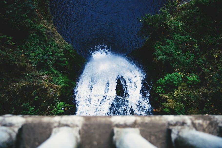 person looking down on waterfalls, photo of waterfalls near on grass field HD wallpaper