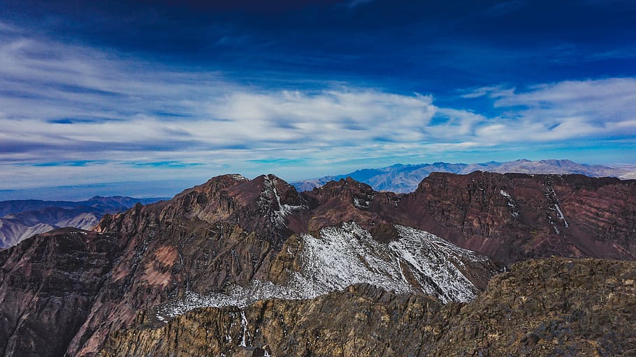 rock mountain under blue sky, photo of brown and red mountains during daytime HD wallpaper