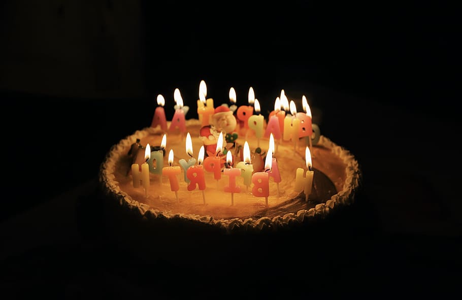 lighted assorted-color birthday candles in cake, cake with happy birthday candles HD wallpaper