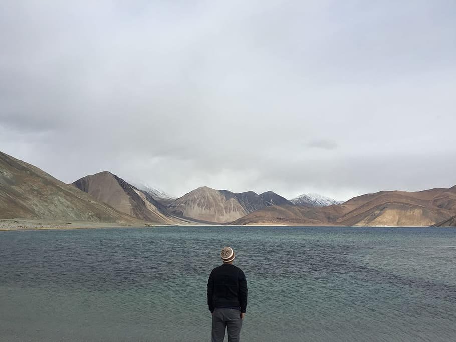 sky, man, water, clouds, back view, cloudy, gloomy, idyllic, lake HD wallpaper
