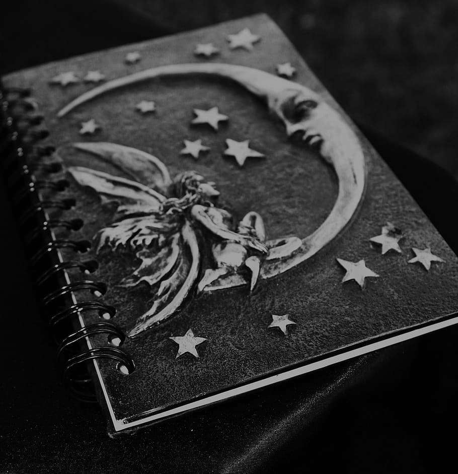black and gray notebook with embossed crescent moon and fairy design, HD wallpaper