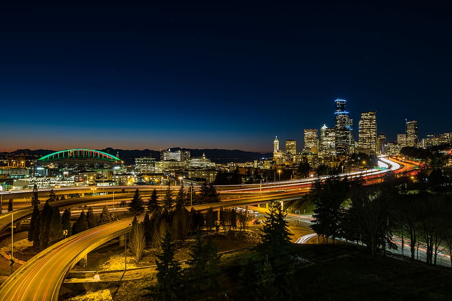 timelapse photography of road and buildings, time lapse photography of city during nighttime HD wallpaper
