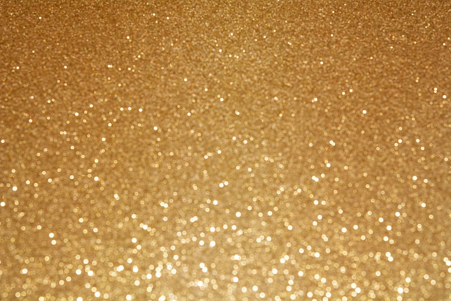 photo of gold glitter textile, background, glittering background