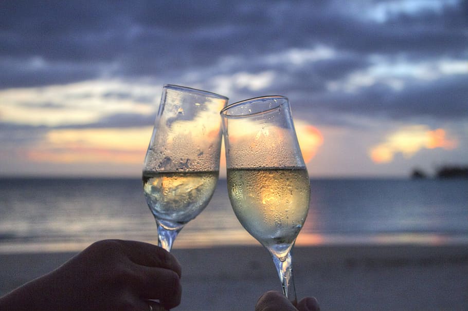 sea, sunset, beach, couple, champagne, cheerful, cheers, clink glasses