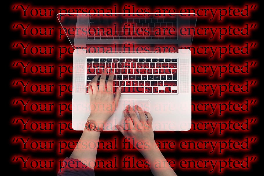 person using MacBook Pro, Laptop, Keyboard, Cyber, Attack, wannacry