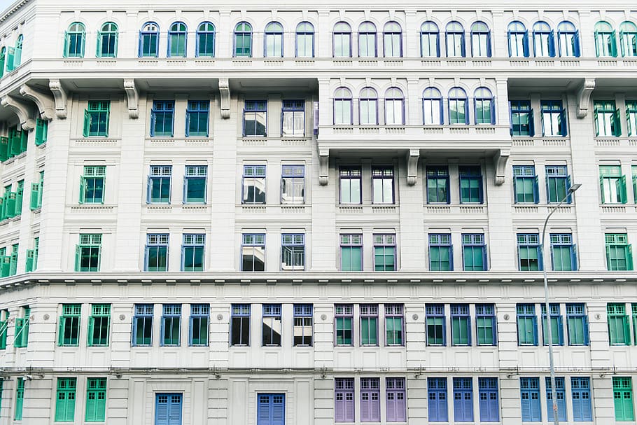 architectural photography of beige concrete building, high-rise building at daytime HD wallpaper
