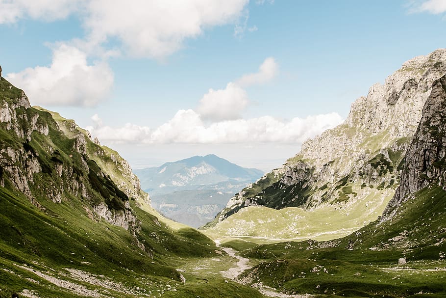green mountains under cloudy sky, green mountains under blue sky during daytime HD wallpaper