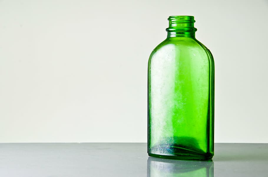 HD wallpaper: green glass bottle on top of gray surface, green empty,  vintage | Wallpaper Flare