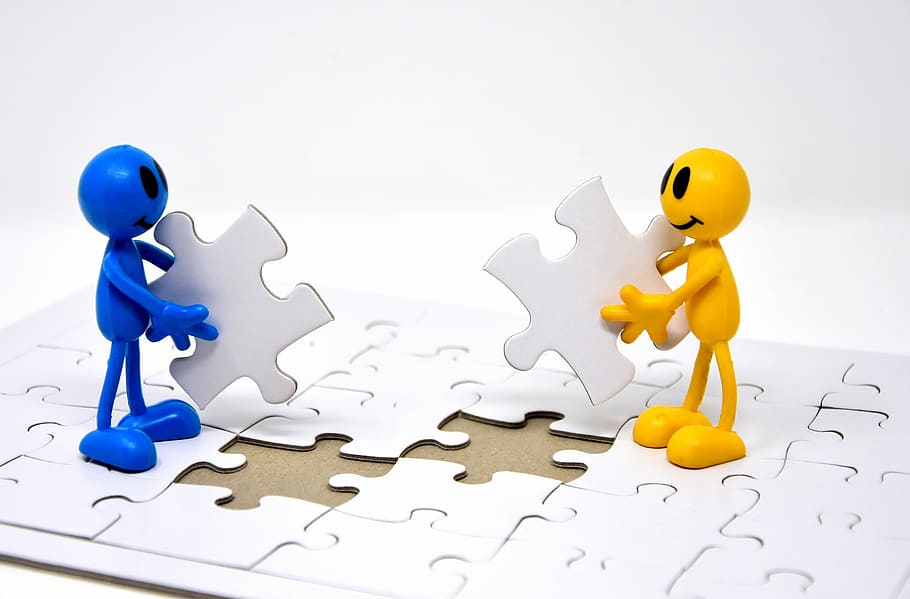 two blue and yellow figure holding puzzle, teamwork, together, HD wallpaper