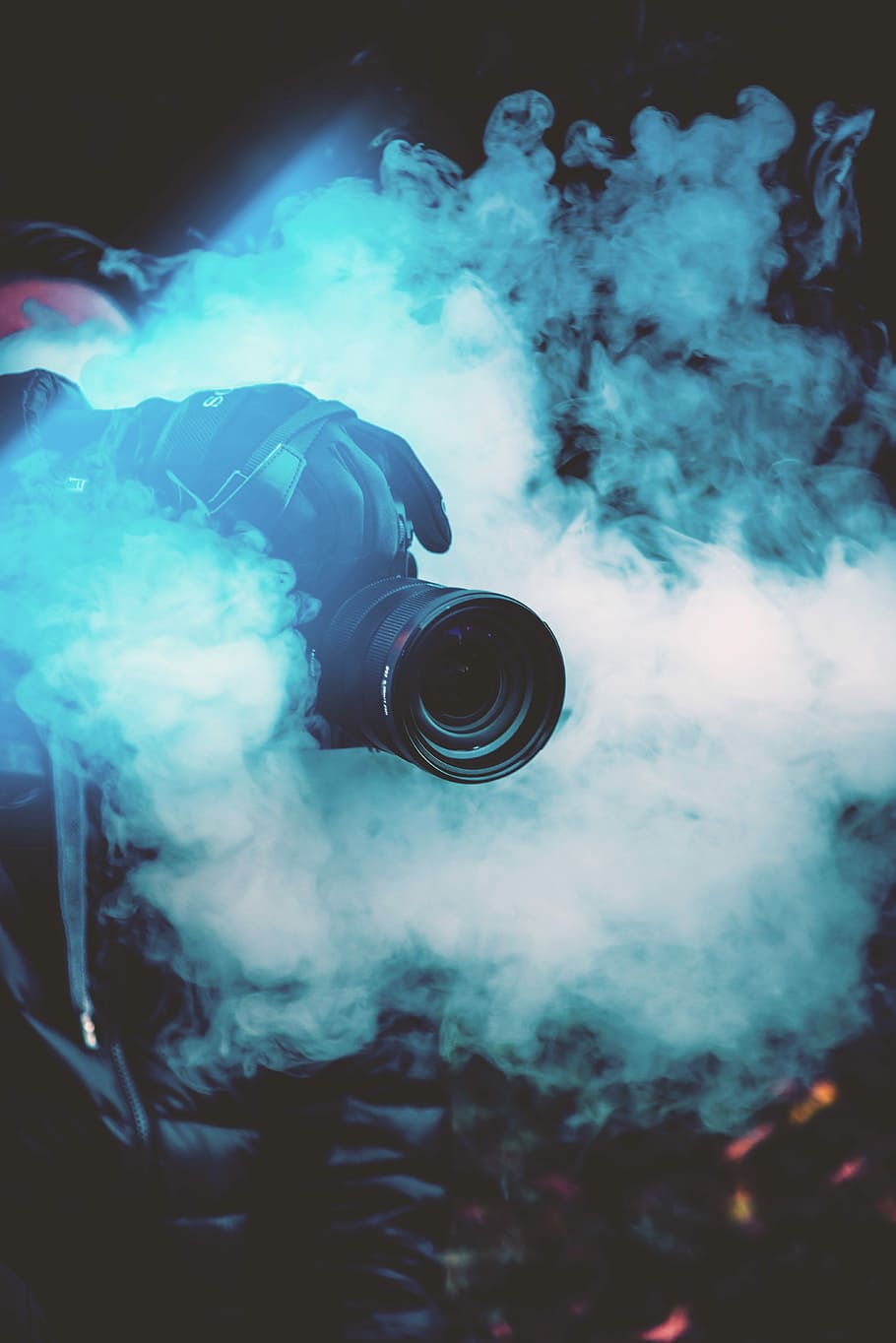 person holding DSLR camera with fogs, black DSLR camera above smoke HD wallpaper