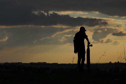 silhouette of man, shadow, skateboard, longboard, sky, clouds HD wallpaper