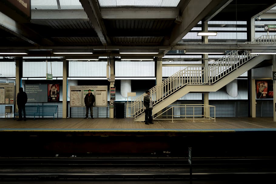 three person waiting on train station, people standing near train rails HD wallpaper