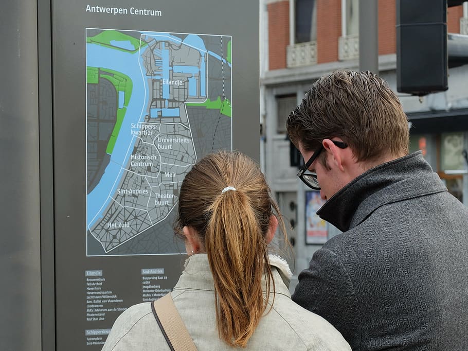 man and woman looking at Antwerpen Centrum map, tourists, map reading, HD wallpaper