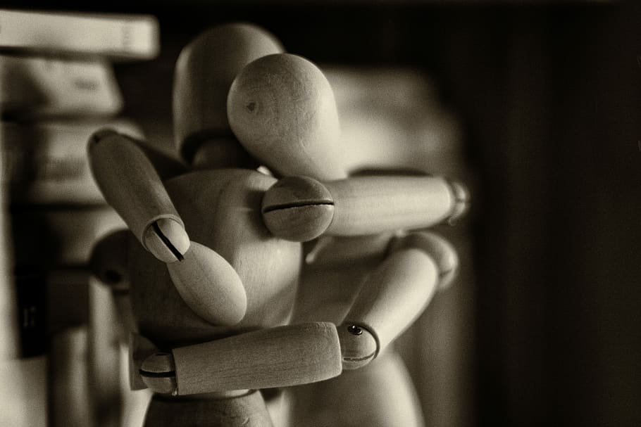 two wooden dummy hugging figures, two beige wooden manikin hugging, HD wallpaper