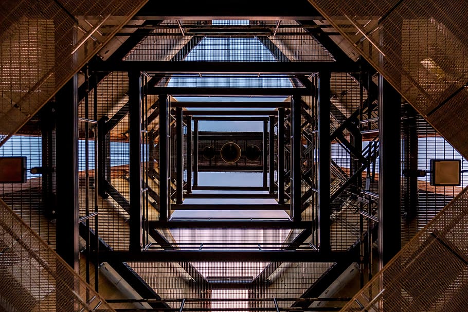 low angle photography of black and brown metal scaffolding frames during daytime, HD wallpaper