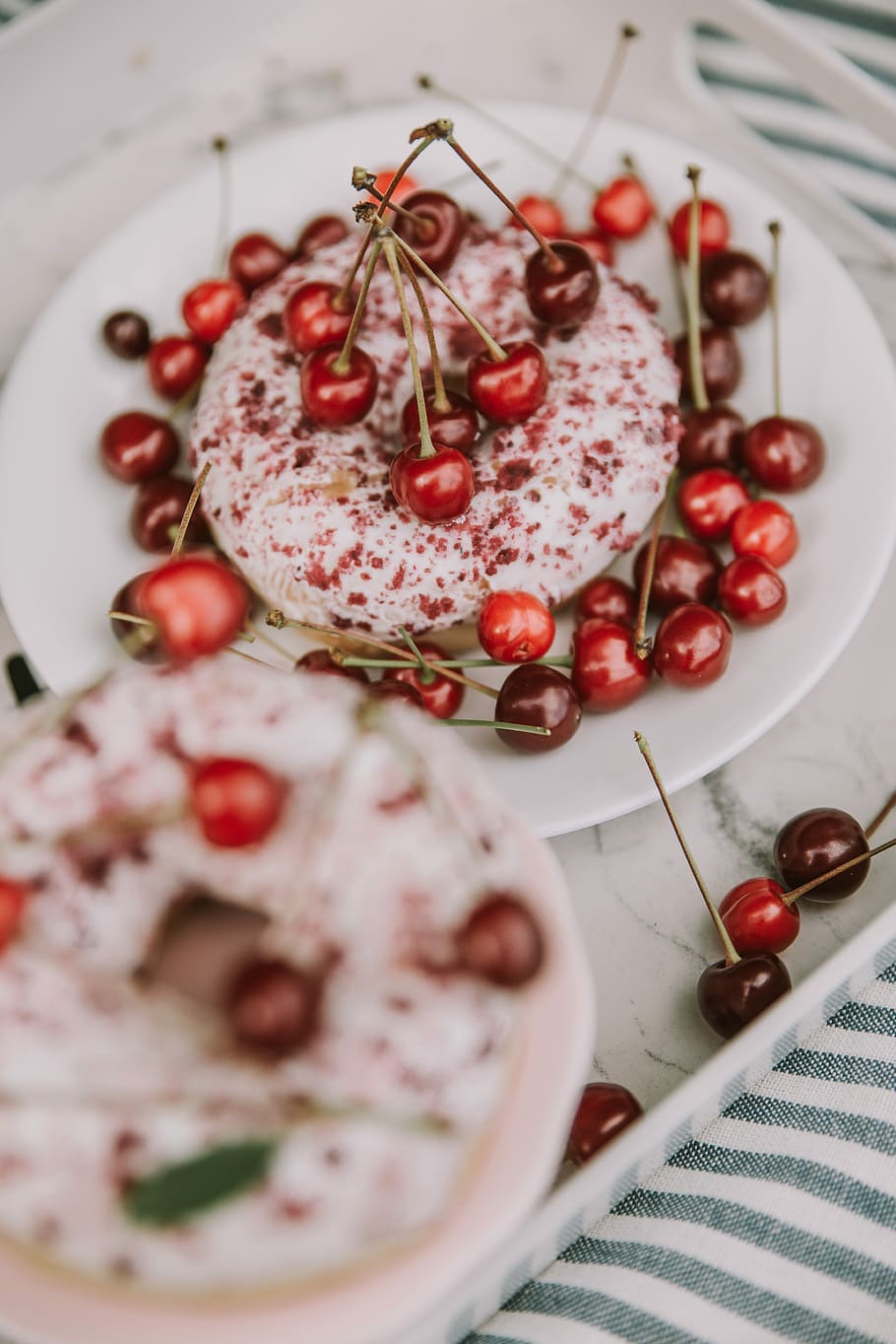 cup cake with cherry on top, closeup photo of doughnut with cherries on plate HD wallpaper