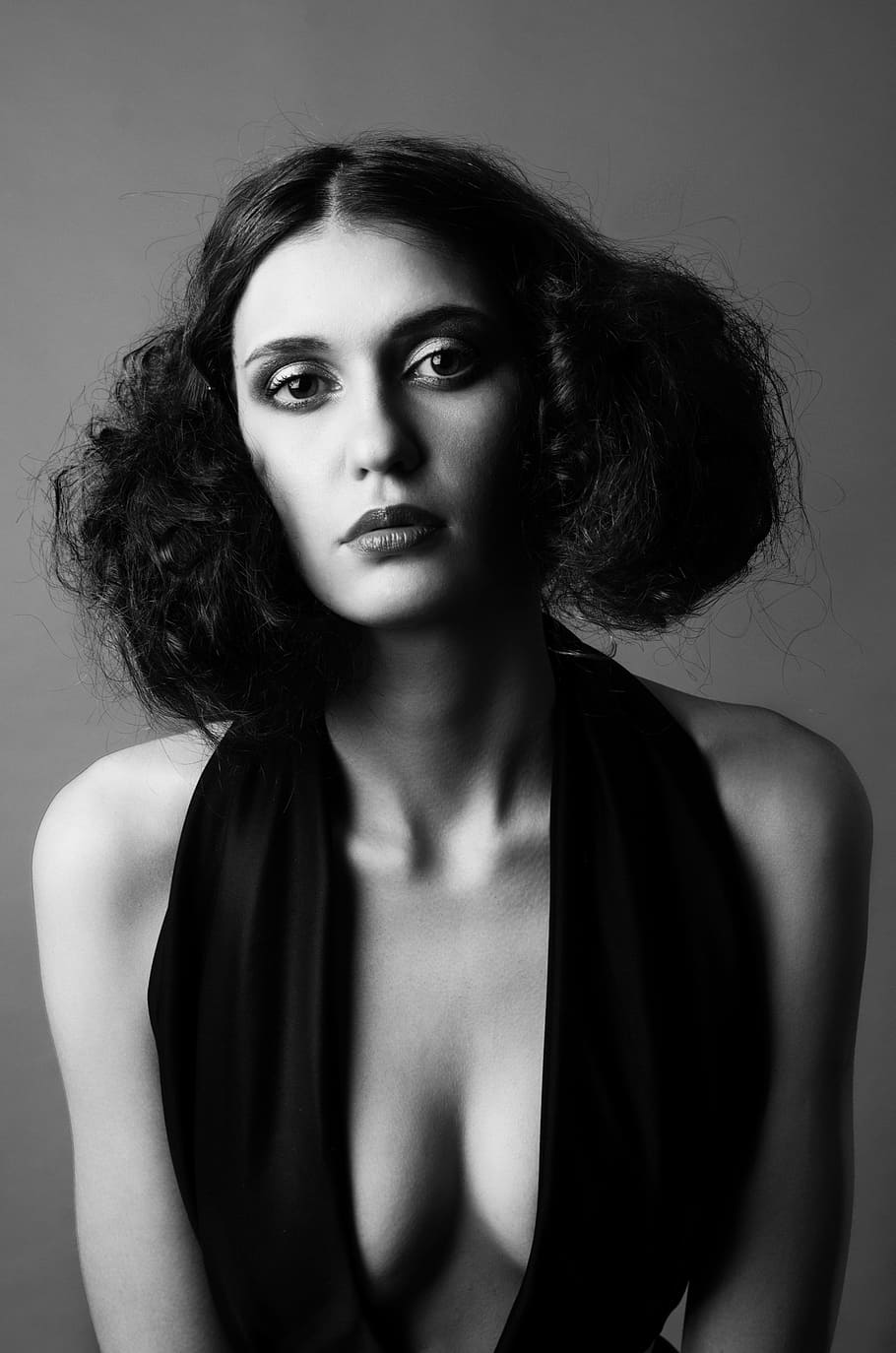 grayscale photography of woman wearing deep v-neck halter top HD wallpaper