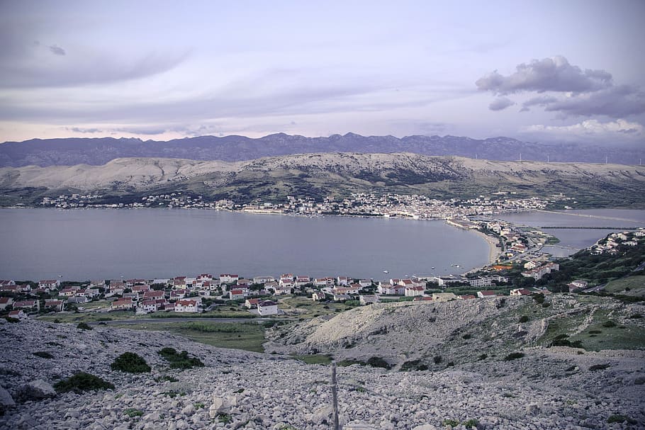 aerial shot of concrete structures near body of water, aerial photography of houses and body of water at daytime HD wallpaper