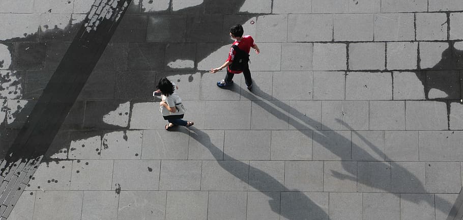 man and woman walking, high angle photo of man and woman walking HD wallpaper
