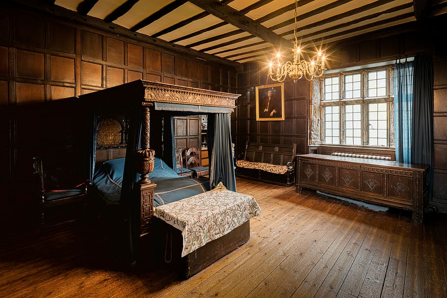 empty brown wooden bedroom furnitures, turned on candle light chandelier HD wallpaper