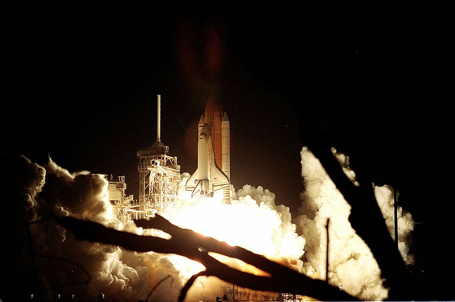 rocket launching photo, space shuttle, discovery, liftoff, night