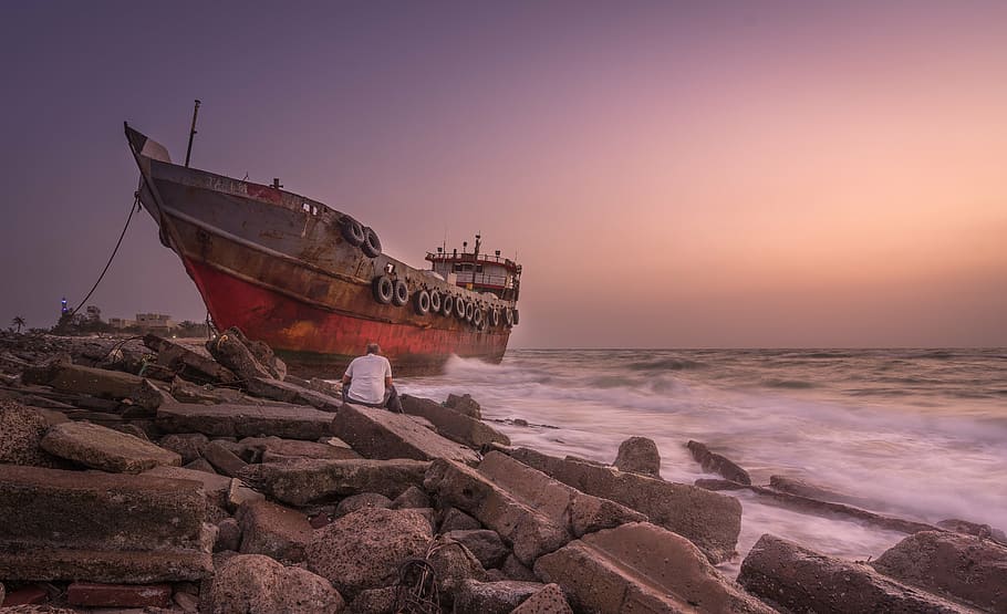 beach, boat, dawn, ocean, person, rocks, sand, sea, seascape HD wallpaper