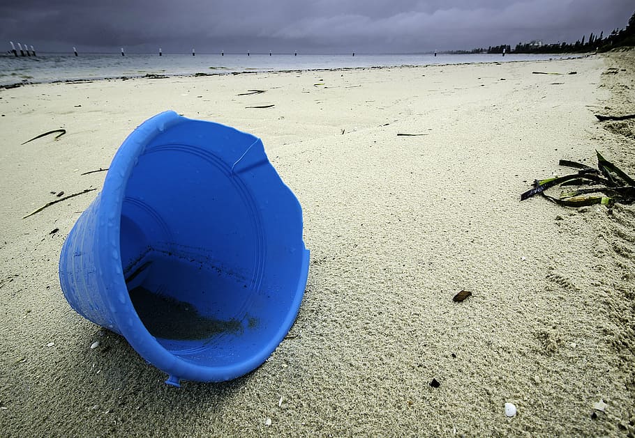 photo of blue plastic pail on beach, abandoned, bucket, sand