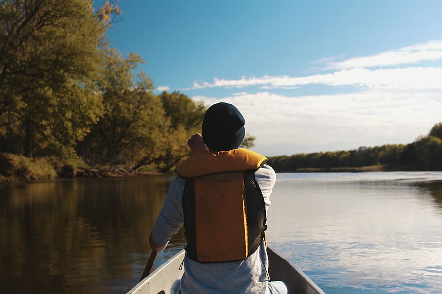 person wearing flotation vest rowing boat, person facing backwards riding on boat HD wallpaper