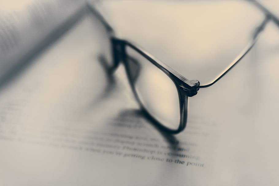 tilt shift photography of eyeglasses with silver-colored frames HD wallpaper