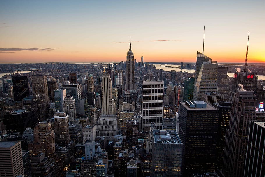 aerial photography of high-rise buildings during sunset, aerial view of Empire State Building surrounded by commercial high-rise buildings during orange sunset, HD wallpaper
